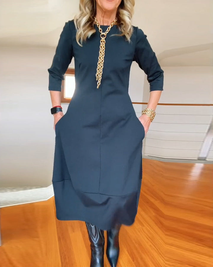 Robe élégante de couleur unie avec poche et col rond